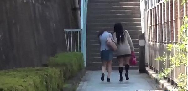  Embarrassed asian pissing outdoors